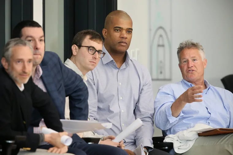 Brett Brown (right) is joined by Marc Eversley (center), vice president of player personnel, and Sixers executive Ned Cohen during a predraft workout on June 12. Cohen and Eversley, along with three others, will join Brown in the Sixers' war room.