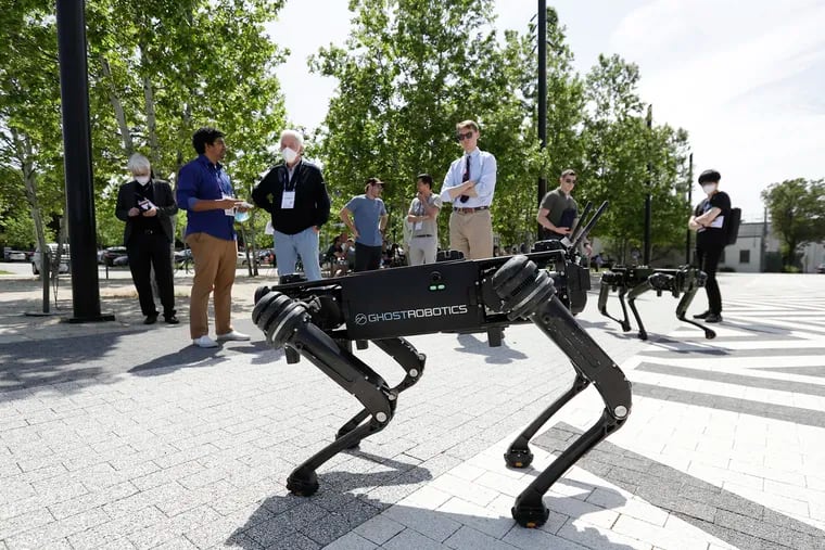 Ghost Robotics Vision 60 robots walk the grounds during the Penn Engineering and Applied Sciences of General Robotics, Automation, Sensing and Perception Lab (GRASP) Technical Tours look at the Pennovation Center on Monday, May 23, 2022.  Penn is hosting the 2022 IEEE International Conference on Robotics and Automation at the Pennsylvania Convention Center, this week.