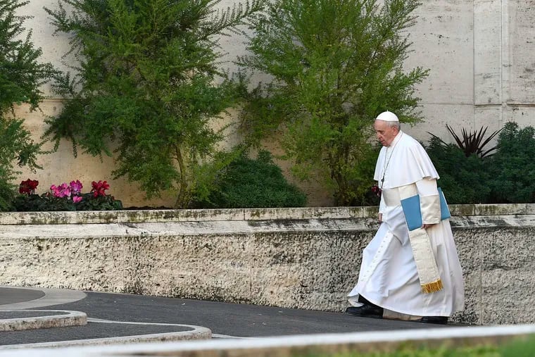 Pope Francis arrives for the opening of a sex abuse prevention summit Thursday at the Vatican.