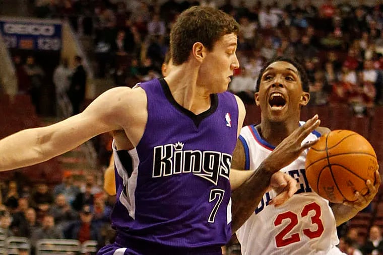 Kings' Jimmer Fredette fouls Sixers' Lou Williams last night.