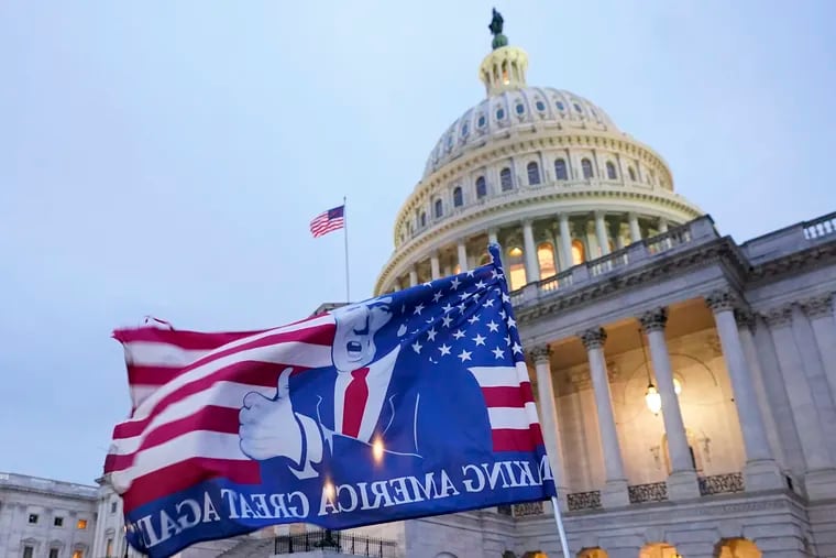 A flag depicting President Donald Trump flew on the East Front of the U.S. Capitol on Jan. 6, 2021.