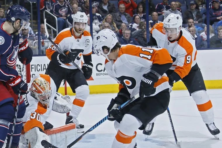 Michal Neuvirth makes a save in the Flyers’ 2-1 overtime win Friday in Columbus.