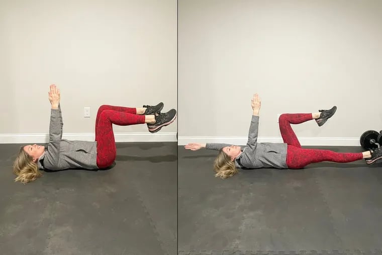 Demonstrating the "dead bug" exercise.