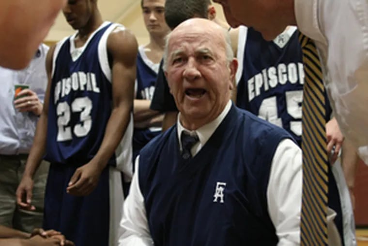 Episcopal Academy coach Dan Dougherty talks strategy with his team during a timeout.