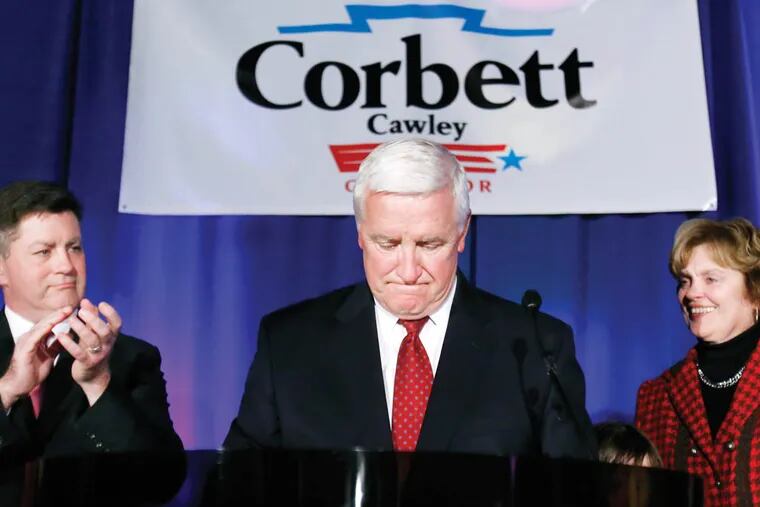 Pennsylvania Governor Tom Corbett, center, pauses as he stands with wife Susan, right, and Lt. Gov. Jim Cawley as he concedes the election to Tom Wolf, Tuesday, Nov. 4, 2014 in Pittsburgh. (AP Photo/Gene J. Puskar)
