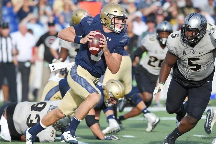 Navy quarterback Zach Abey gains yards on a keeper in the second quarter against Central Florida on Saturday.