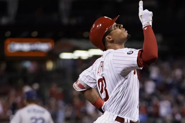 Phillies outfielder Aaron Altherr celebrates his grand slam in the sixth inning off Dodgers pitcher Clayton Kershaw.