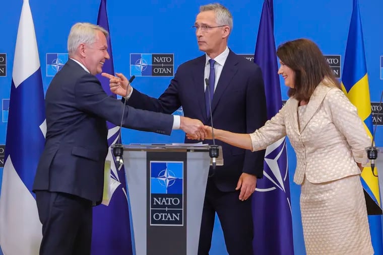 Finland's Foreign Minister Pekka Haavisto (left), Sweden's Foreign Minister Ann Linde (right), and NATO Secretary General Jens Stoltenberg attended a media conference after the signature of the NATO Accession Protocols for Finland and Sweden in the NATO headquarters in Brussels on July 5.