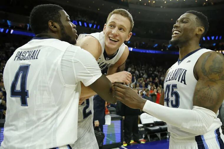 Villanova guard Donte DiVincenzo (center) celebrates his last-second tap-in to beat Virginia with teammates Eric Paschall and Darryl Reynolds.