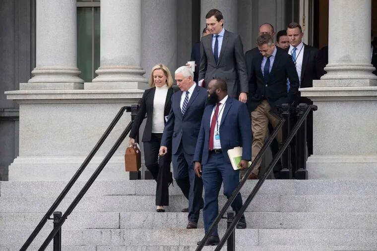 Homeland Security Secretary Kirstjen Nielsen, left, Vice President Mike Pence, White House legislative affairs aide Ja'Ron Smith, followed by White House Senior Adviser Jared Kushner, and others, walk down the steps of the Eisenhower Executive Office building, on the White House complex, after a meeting with staff members of House and Senate leadership, Saturday, Jan. 5, 2019, in Washington. (AP Photo/Alex Brandon)