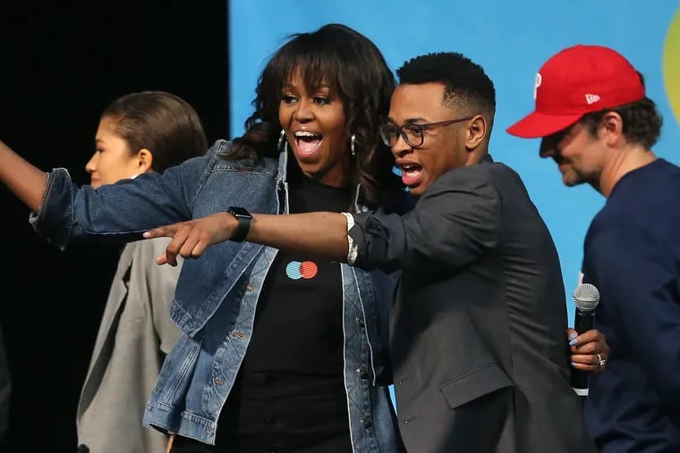 Tamir Harper, onstage with former First Lady Michelle Obama at National College Signing Day.