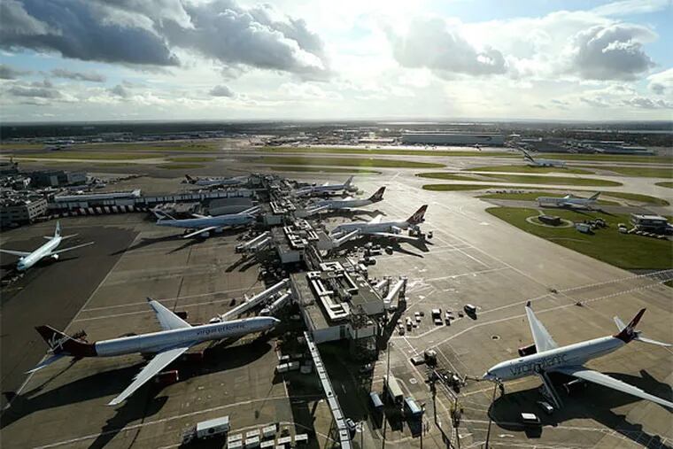 Heathrow Airport, where a merged US Airways-American will give up a slot to a London-Philadelphia competitor. (Bloomberg News)