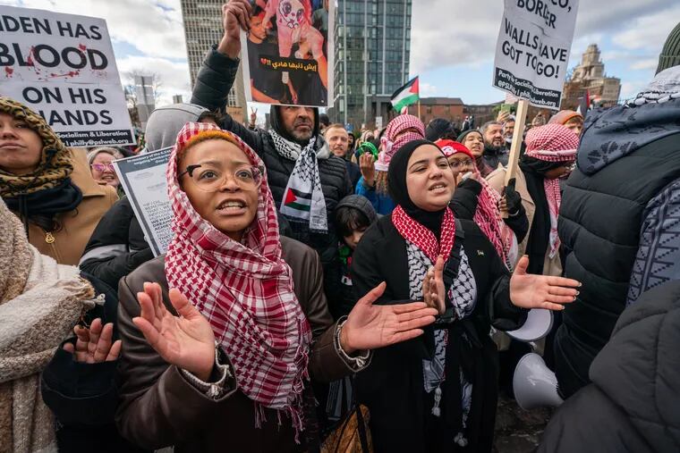 Sara Vaughn Coleman, front left, and Ayanna Abdul - Ali, front right, at a demonstration of Pro-Palestinian supporters protesting President Joe Biden's visit to Philadelphia across from the Hilton Hotel on Delaware Ave., in Philadelphia on Monday.