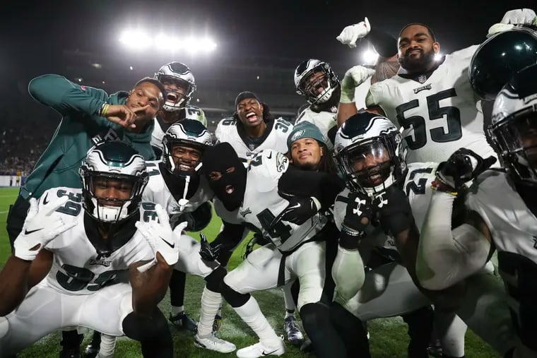The Eagles' defense -- with Corey Graham in the center, wearing a face mask -- celebrates after Graham intercepted Rams quarterback Jared Goff in the third quarter.