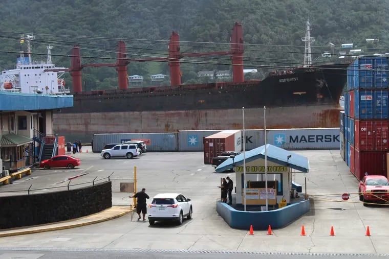 A view from the top of a two story building in Fagatogo village overlooking the Port of Pago Pago, as the North Korean cargo ship, Wise Honest, docks at the main docking section of Pago Pago Harbor, Saturday, May 11, 2019, in Pago Pago, American Samoa. The North Korean cargo ship was seized by the U.S. because of suspicion it was used to violate international sanctions. It arrived Saturday at the capital of this American territory. (AP Photo/Fili Sagapolutele)