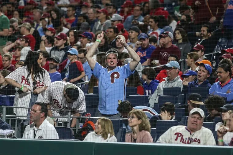 A Phillies fan tries to get the crowd up against the Mets during the 9th inning of a 2-0 loss at Citizens Bank Park.