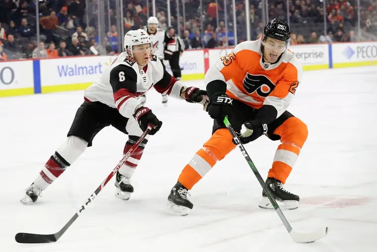 Flyers left wing James van Riemsdyk skating with the puck against Coyotes defenseman Jakob Chychrun on Thursday.