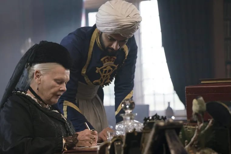 In this image released by Focus Features, Judi Dench, left, and Ali Fazal appear in a scene from &quot;Victoria and Abdul.&quot; (Peter Mountain/Focus Features via AP)