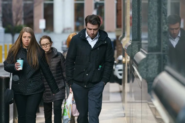 Jack Miley, center, former roommate of accused murderer Joshua Hupperterz, and his older sister, Courtney Miley (left), return to the Criminal Justice Center after a lunch break Friday, Jan. 11.