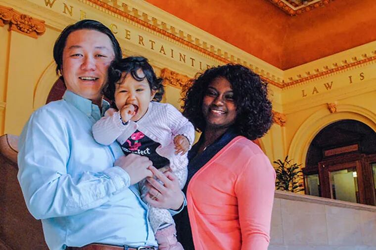 Dafan Zhang, a Penn Law Student running for 164th District seat in the State House of Representatives, stands with his wife and daughter on March 6, 2014. ( GABRIELA BARRANTES / STAFF PHOTOGRAPHER )