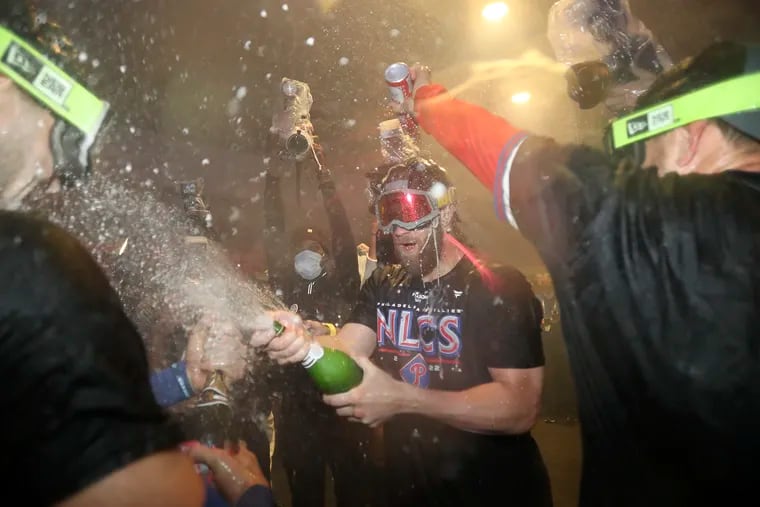 Bryce Harper celebrated after the Phillies beat the Atlanta Braves on Oct. 15. On social media, some fans worried that the revelry might lead players to get sick.