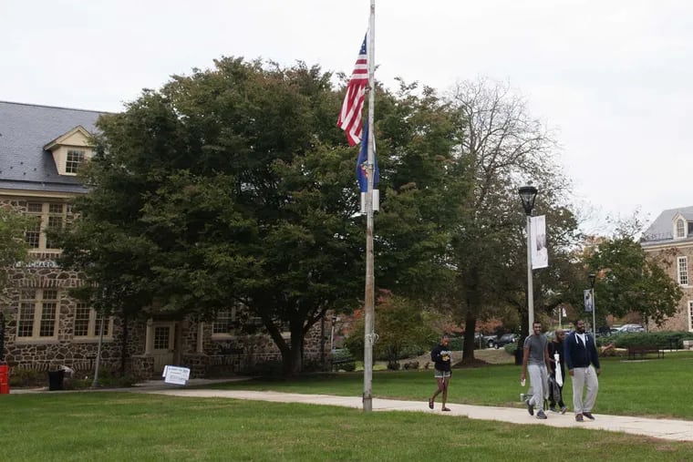 Students walking across campus at Cheyney University.