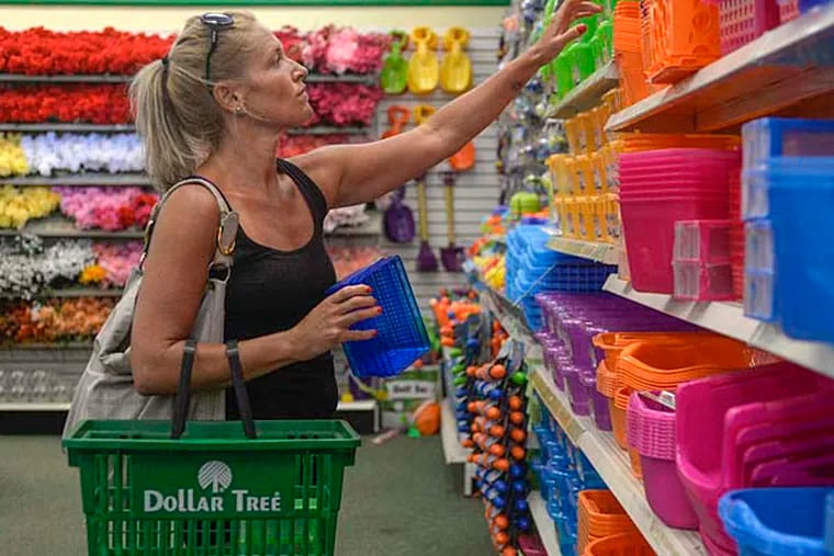 Christel DiVincenzo of Havertown shops at the Dollar Tree in Broomall. The 11,000-square-foot site generates the largest volume in sales among the 150 Dollar Trees in the Philadelphia region, management says. ( BEN MIKESELL / Staff Photographer )