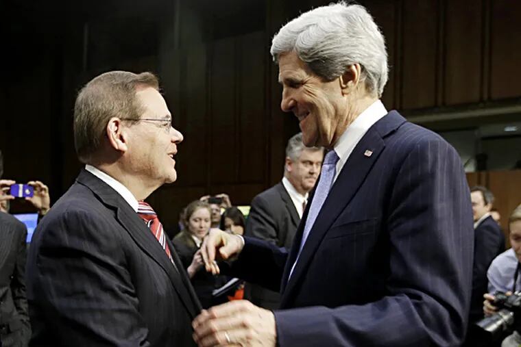 U.S. Sen. Bob Menendez (left) with Sen. John Kerry, whom Menendez will succeed as head of the Senate Foreign Relations Committee if Kerry is confirmed as secretary of state.
