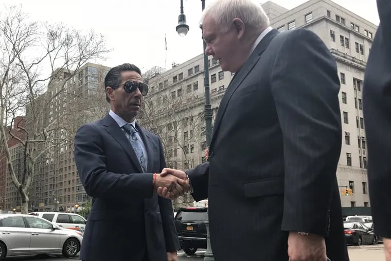 Joey Merlino, the reputed Philadelphia mob boss, shakes hands with his lawyer, Edwin J. Jacobs Jr., after pleading guilty to a gambling-related charge in federal court in New York last week.
