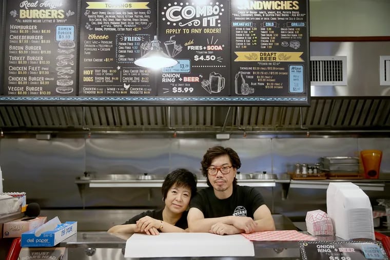 Mimi Yang and Moon Yang at the counter of their new Market Street steak shop. Mimi still cries for their old shop at the Bourse.