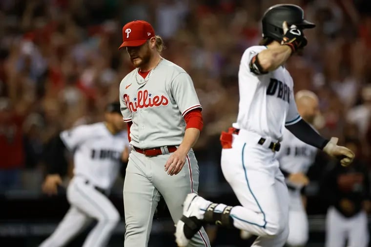 Phillies pitcher Craig Kimbrel walks off the field after losing to the Diamondbacks on a walk-off hit by Ketel Marte in Game 3 of the NLCS at Chase Field.
