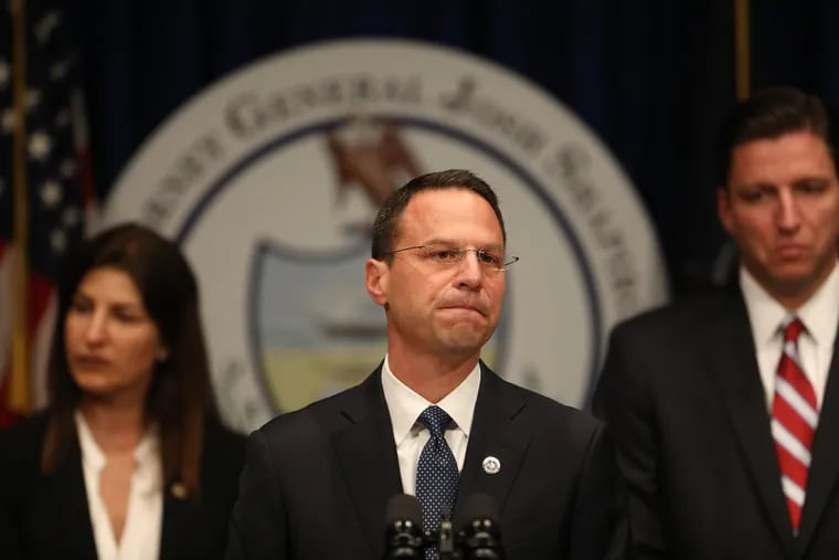Pennsylvania Attorney General Josh Shapiro is flanked by members of his investigative team, including Daniel Dye, right, who has spent more than four years investigating clergy abuse for the office, beginning under Shapiro's predecessor, Kathleen Kane.