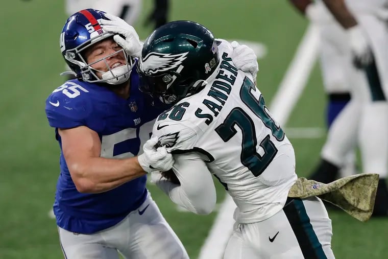 Could this be the game in which Eagles running back Miles Sanders, seen here shoving Giants linebacker Kyler Fackrell on Sunday, is the focus of the Birds' offense?