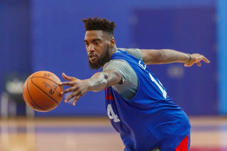 Norvell Pelle works out during a drill at the Sixers' practice facility in Camden on Tuesday.