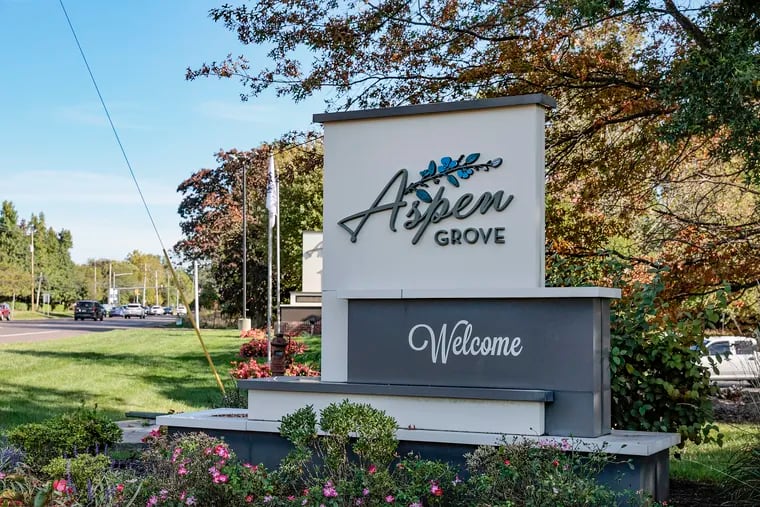A sign welcomes people to Aspen Grove Apartment Homes in Warminster. The complex rejected a Bucks County couple's rental application because of its Social Security number requirement. The owner and property manager settled the family's housing discrimination case for $450,000.