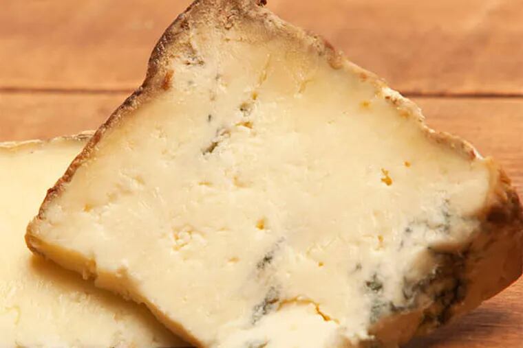 Valley Shepherd's Reading Cheddar (left) and Boxcar Blue cheeses. (Ed Hille/Staff Photographer)