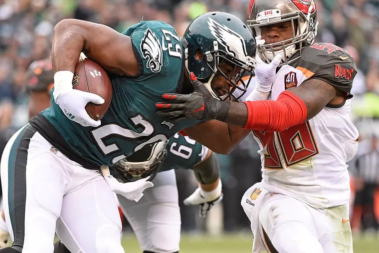 Philadelphia Eagles running back DeMarco Murray (29) is tackled by Tampa Bay Buccaneers middle linebacker Kwon Alexander (58) during the first quarter at Lincoln Financial Field. The Buccaneers defeated the Eagles, 45-17.
