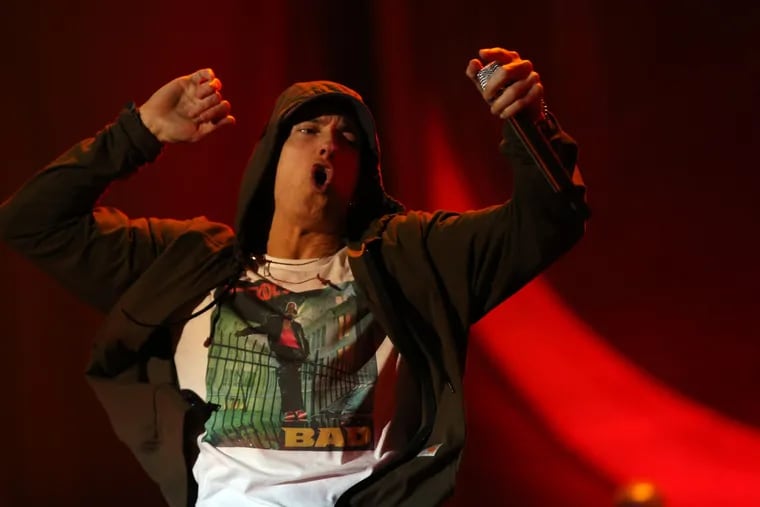 Eminem performs on Friday, Aug. 1, 2014 at Lollapalooza in Grant Park in Chicago. Eminem surprised fans Friday by releasing a new album, his 10th, "Kamikaze."