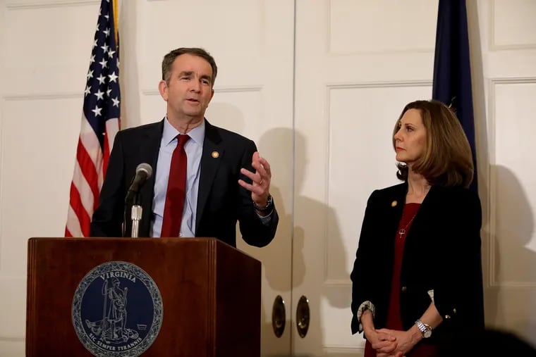 Virginia Gov. Ralph Northam, with his wife Pam at his side, said at a news conference in the Executive Mansion on Saturday, Feb. 2, 2019, that he is not the person in the racist photo in the EVMS yearbook and he will not resign.