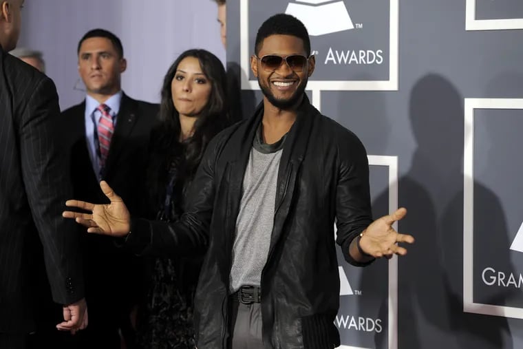 Usher arrives at the 53rd annual Grammy Awards on Sunday, Feb. 13, 2011, in Los Angeles.