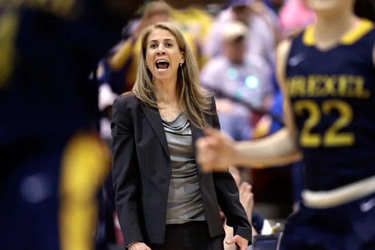 Drexel head coach Denise Dillon directs her players during the first
half of an NCAA college basketball game against Delaware in the championship of the Colonial Athletic Association conference tournament in Upper Marlboro, Md., Sunday, March 17, 2013. (Patrick Semansky/AP)
