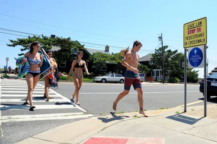 Pedestrians cross Atlantic Avenue in Longport. A  2010 New Jersey pedestrian law requires "the driver of a vehicle must stop and stay stopped for a pedestrian crossing the roadway within any marked crosswalk." Sometimes they do, sometimes they don't.