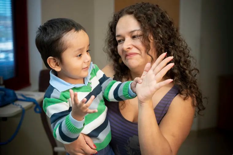 In this April 2019 photo provided by the St. Jude Children's Research Hospital, 2-year-old Gael Jesus Pino Alva is held by his mother, Giannina Alva, at the hospital in Memphis. Gael was one of eight babies with "bubble boy disease" who have had it corrected by gene therapy that ironically was made from one of the immune system's worst enemies - HIV, the virus that causes AIDS. (Peter Barta / St. Jude Children's Research Hospital via AP)