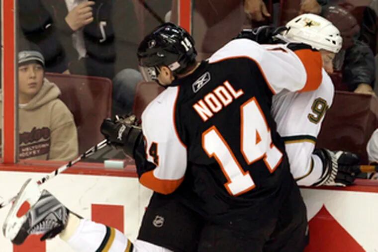 Andreas Nodl takes out Dallas&#0039; Brad Richards during a game in November.