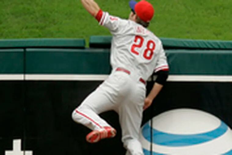 The ball is out of reach of Phils rightfielder Jayson Werth as he tries to field a home run hit by Kansas City&#0039;s Tony Pe&#0241;a in the second inning, giving the Royals a 2-1 lead.