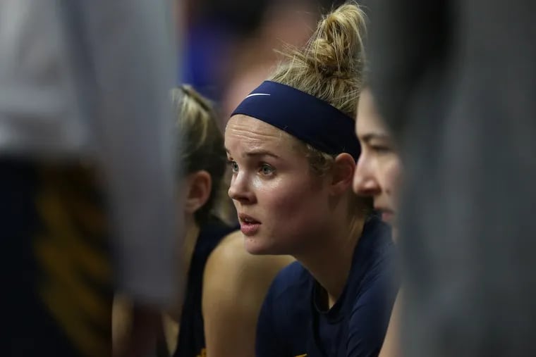 Drexel University Senior Forward Bailey Greenberg (23), listens to her coach during a timeout in the second half of the game against University of Pennsylvania on Friday, Dec. 20, 2019.