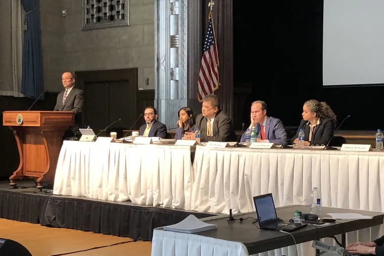 A task force investigating New Jersey tax incentive programs held its first public hearing March 28, 2019 at the Trenton War Memorial. Ronald Chen, center, is chairing the panel.