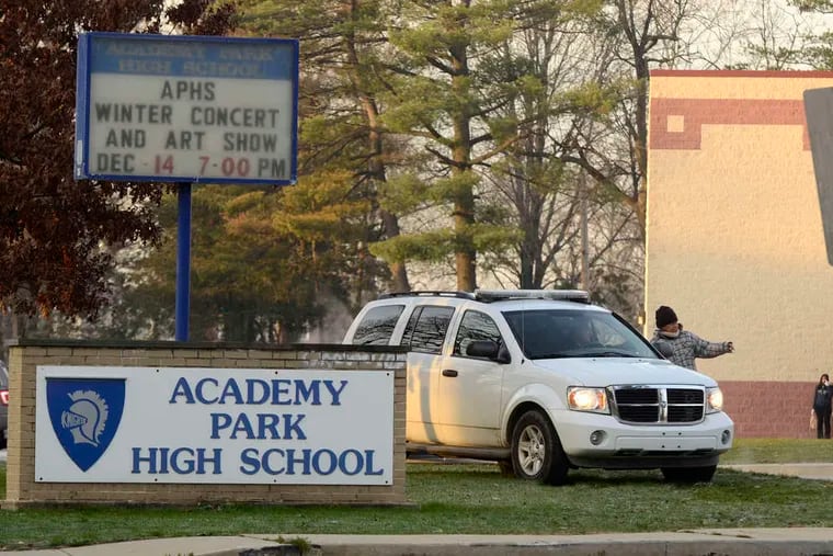 A police vehicle at the entrance to Academy Park High School in Sharon Hill after the weekend hit-and-run deaths of two freshman boys, Michael J. Taylor and Mark McNeill.