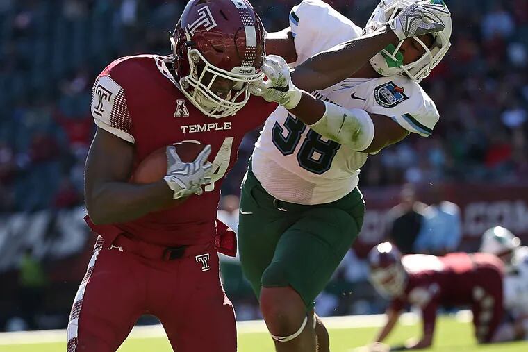 Temple's David Hood scores as Tulane's Roderic Teamer defends.