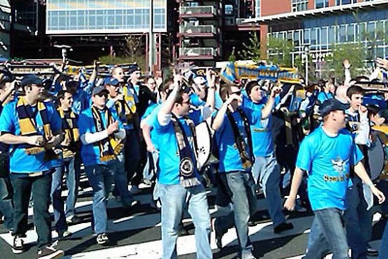 Union fans walk to Lincoln Financial Field in preparation for tonight's home opener against D.C. United. (Bob McGovern / Philly.com)